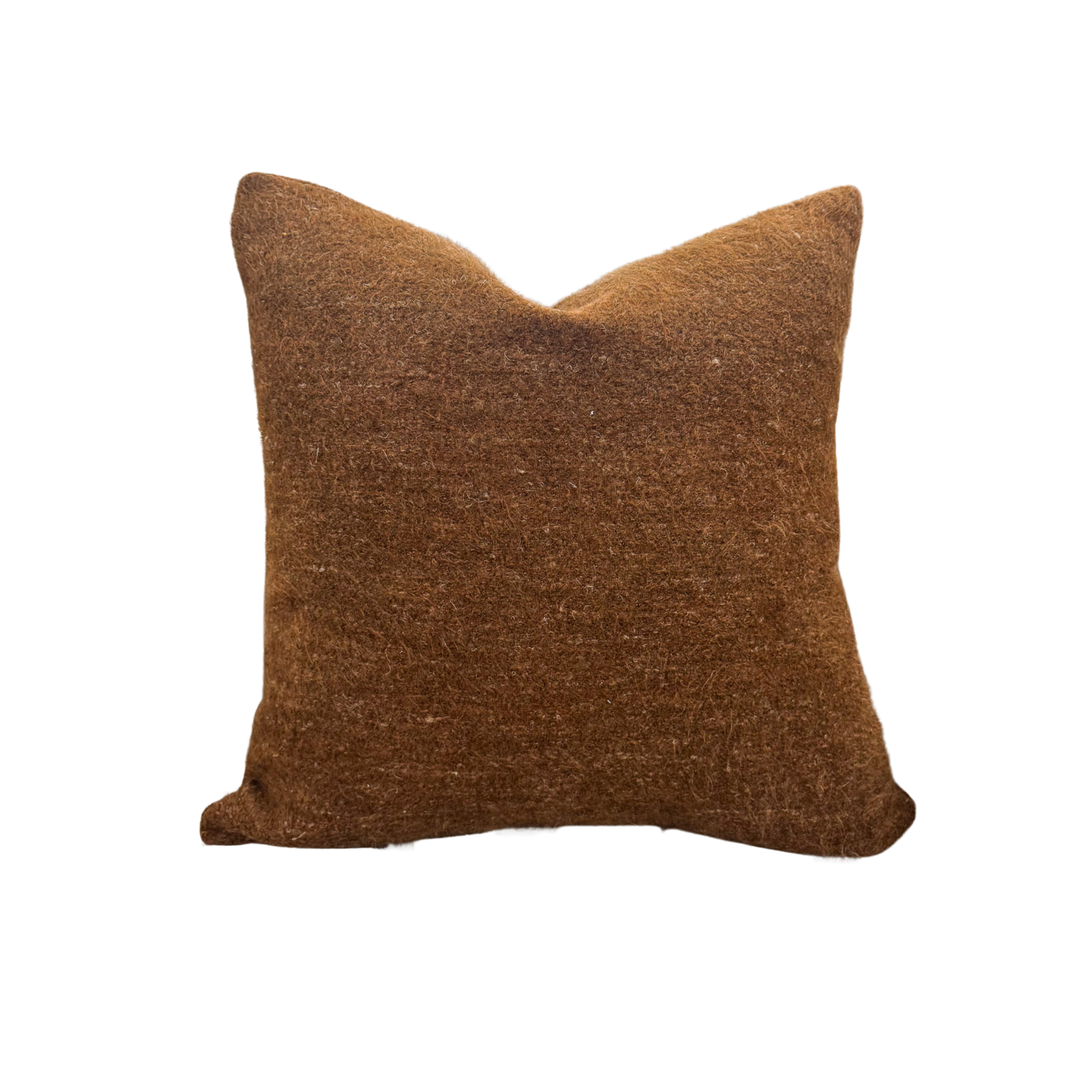 Brown textured pillow on a white background