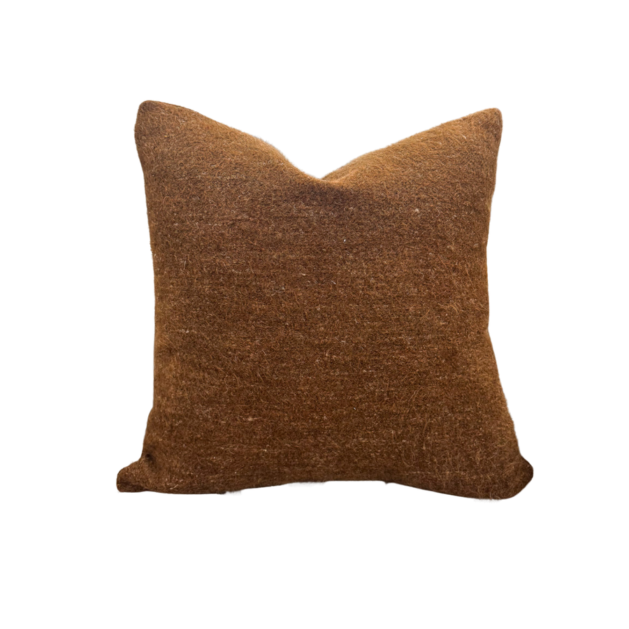Brown textured pillow on a white background