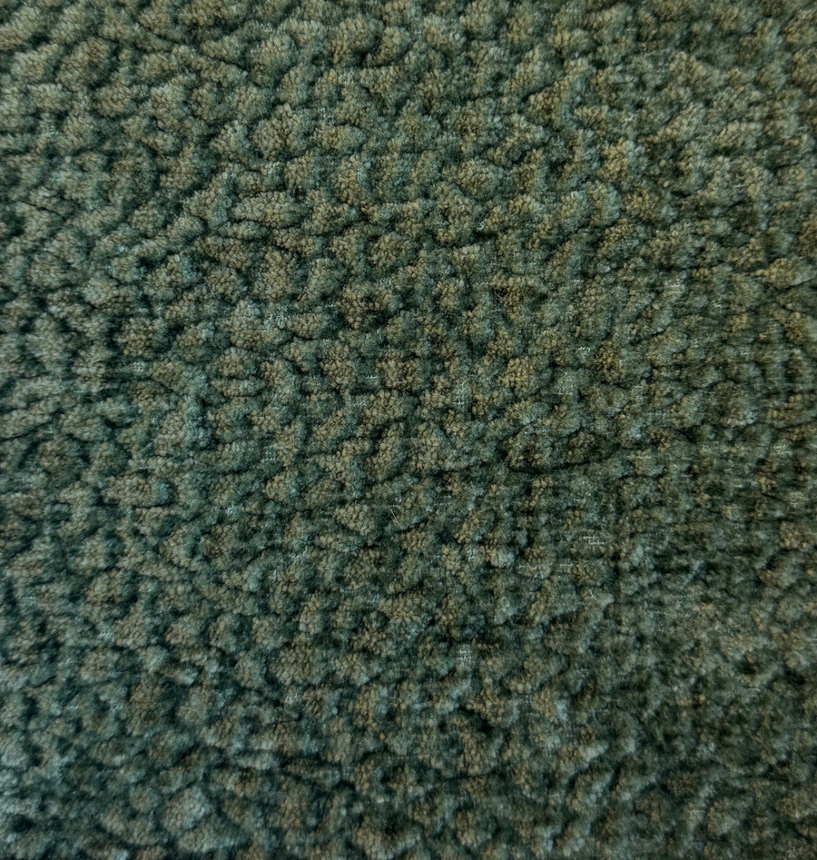 Square piece of green textured fabric on a white background