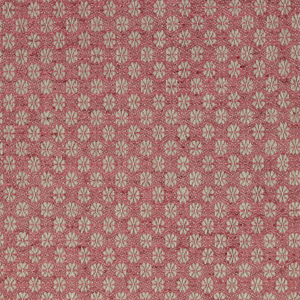 Patterned fabric with small floral design on a pink background