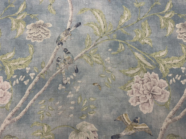 Floral and bird pattern on a textured fabric background