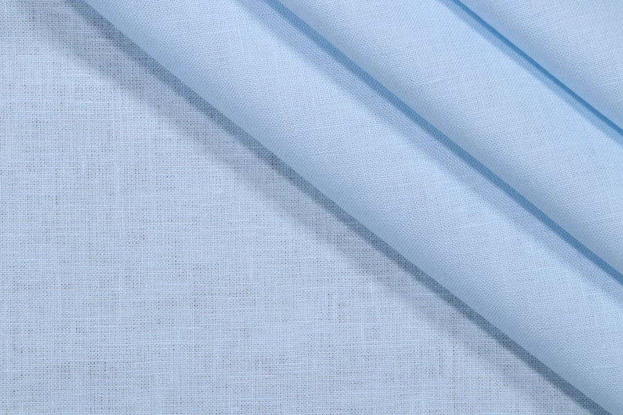Close-up of light blue fabric with a subtle pattern