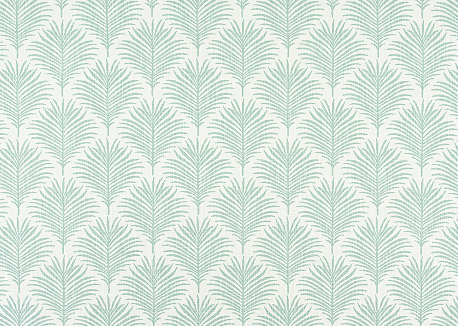 Patterned fabric with palm leaf design on a light blue background