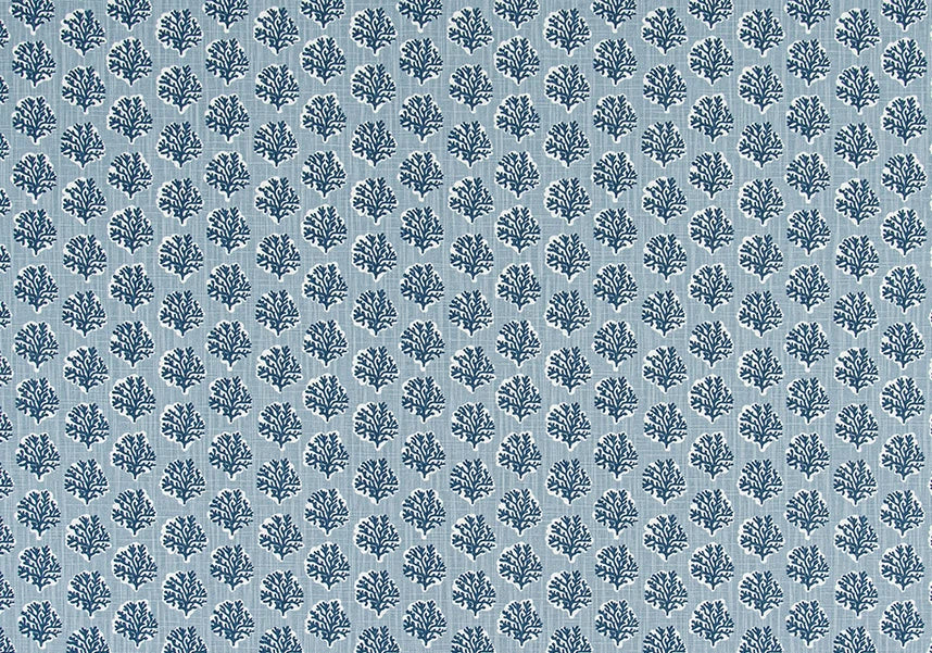 Blue floral coastal patterned fabric on a light blue background