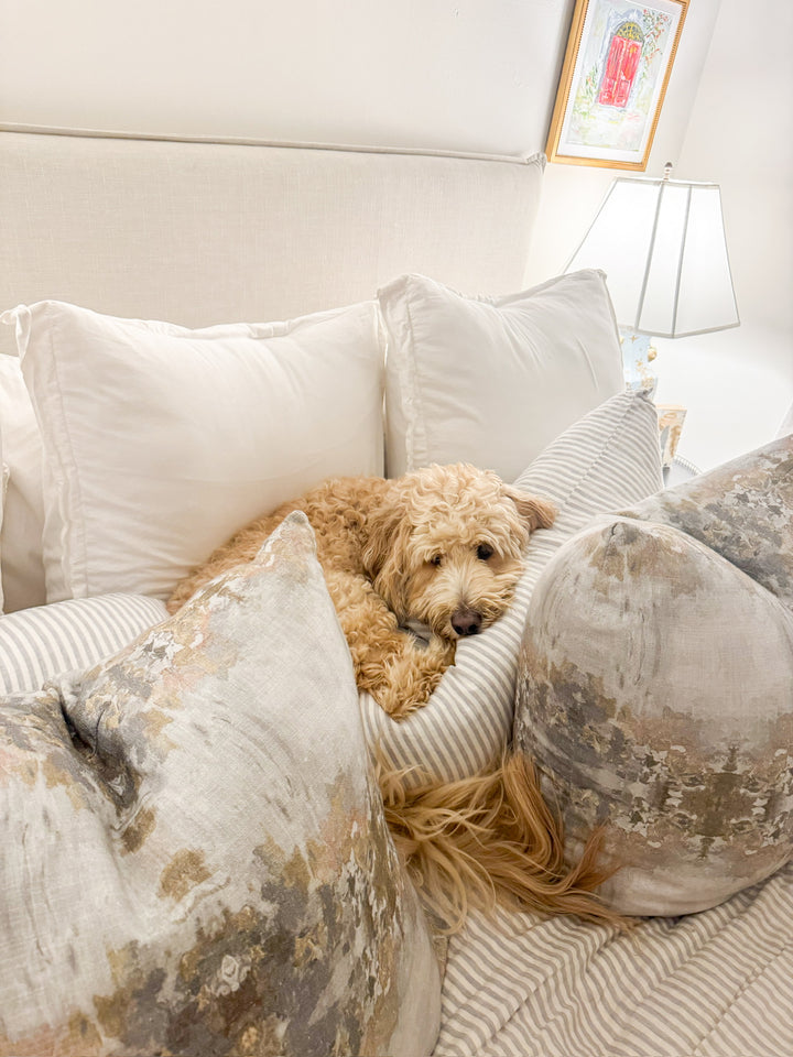 bedroom with matching abstract grey pillows