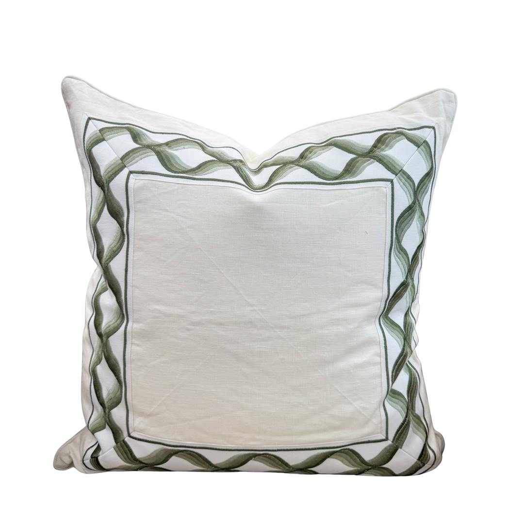 green trim on cream pillow