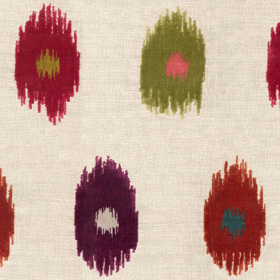 Patterned fabric with abstract shapes in red, green, and purple on a beige background