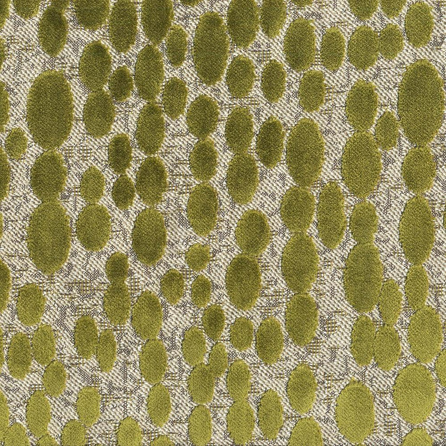 A close-up of a textured fabric pattern featuring olive green circular dots over a beige and gray woven background.