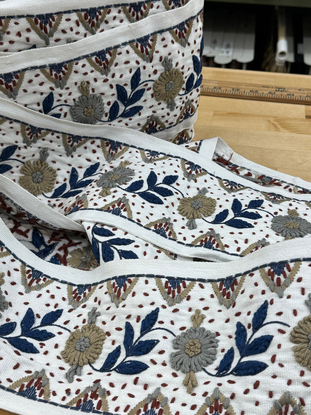 Fabric with floral pattern on a wooden surface