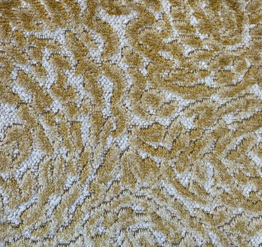 Textured gold and white patterned fabric