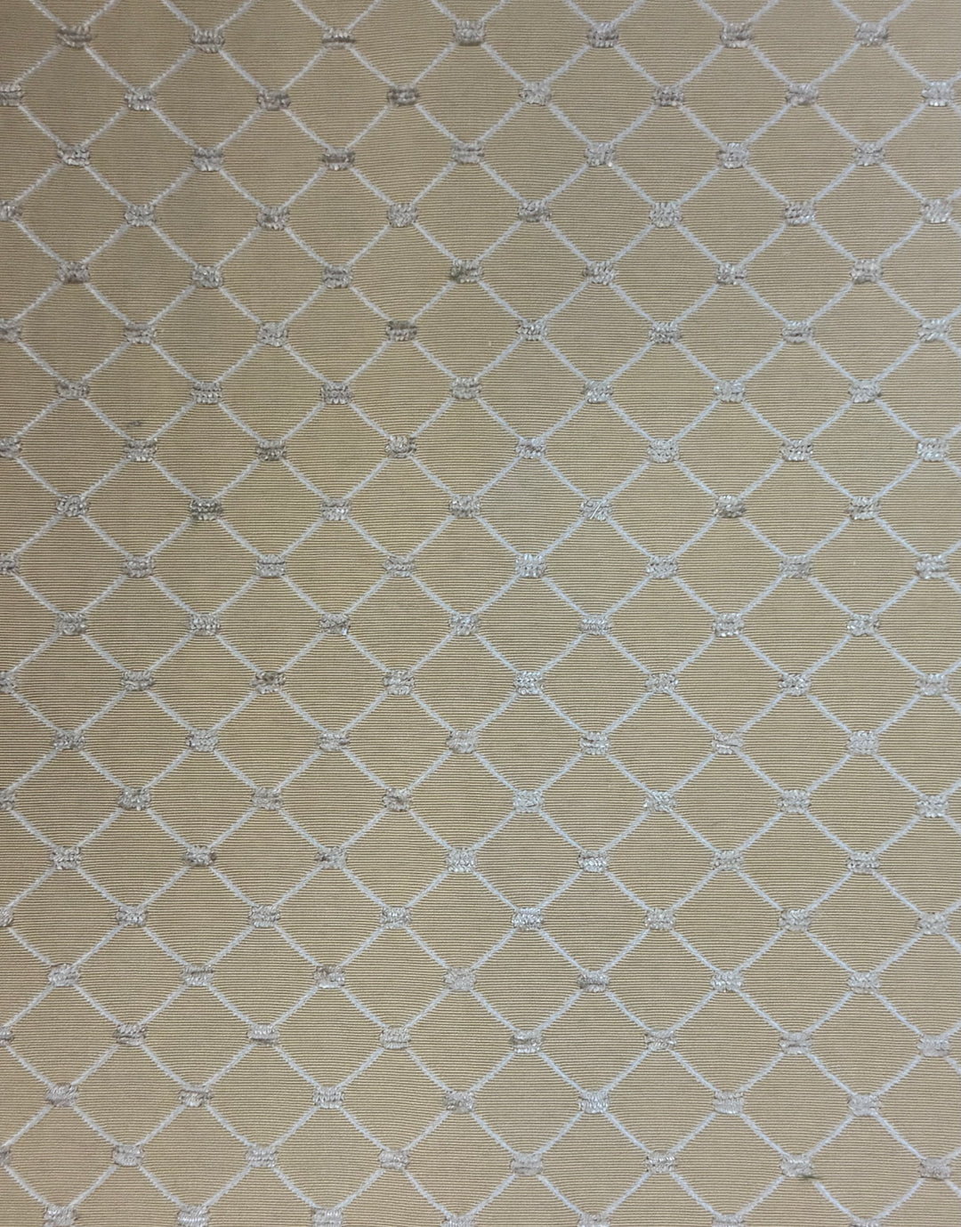 Beige fabric with a white geometric diamond lattice pattern.