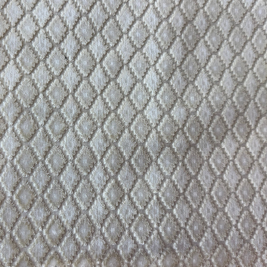 Textured gray fabric swatch held 
