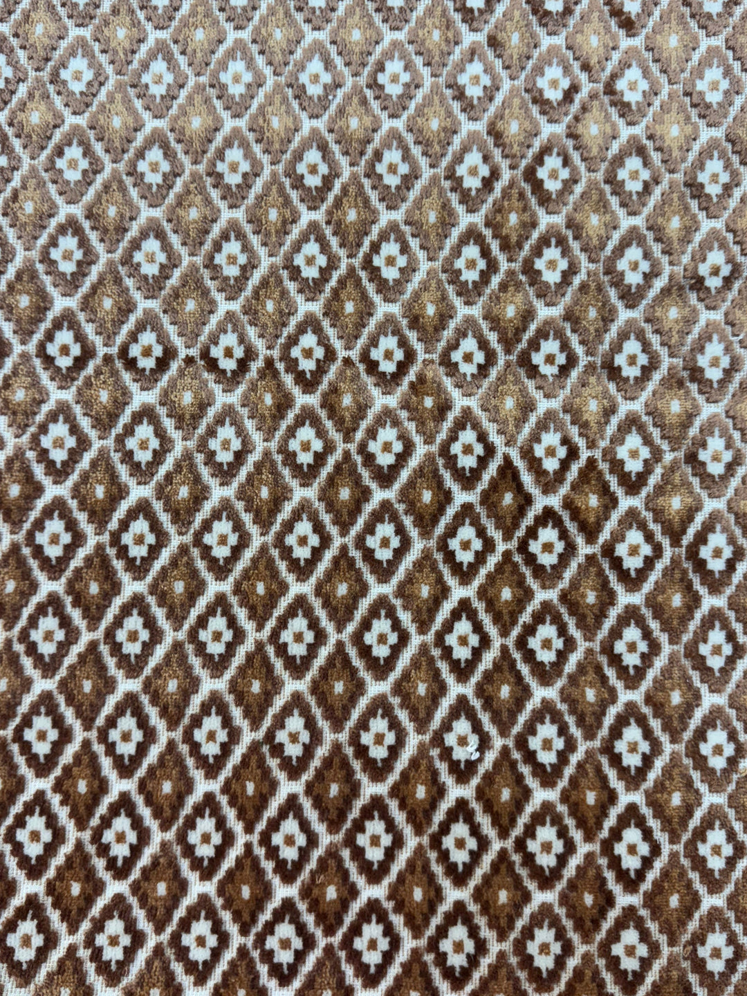 Textile sample with a diamond pattern in brown and white