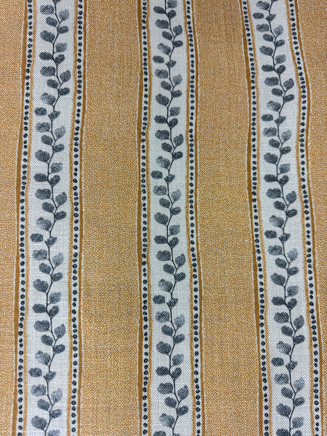 Textile with leaf pattern on a striped background
