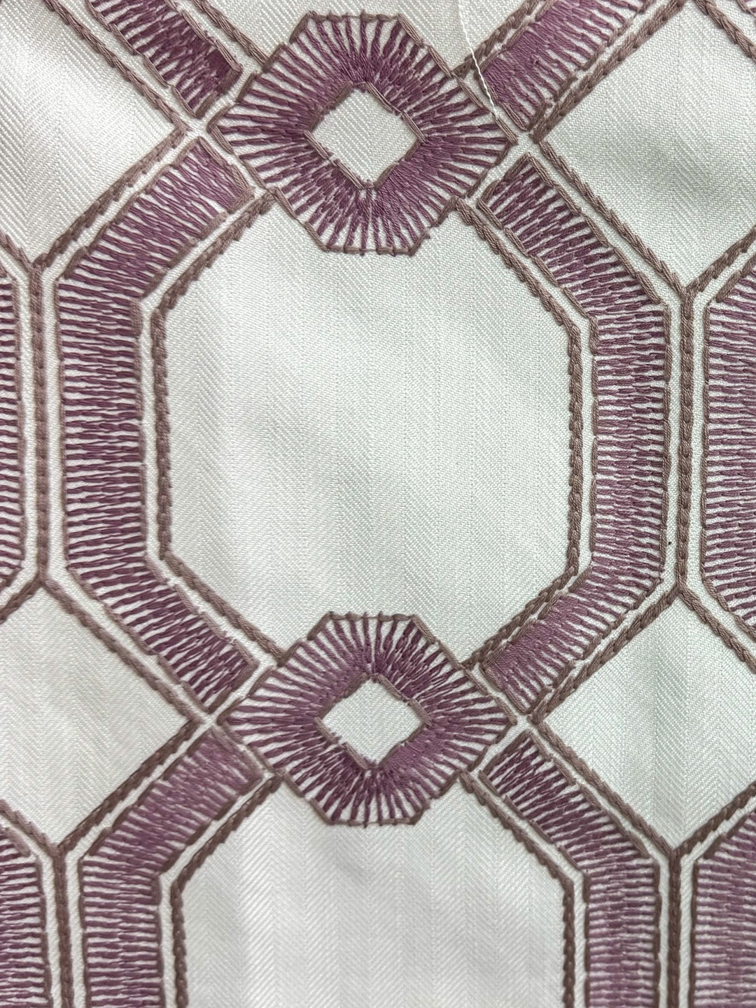 lavender geometric and embroidered fabric