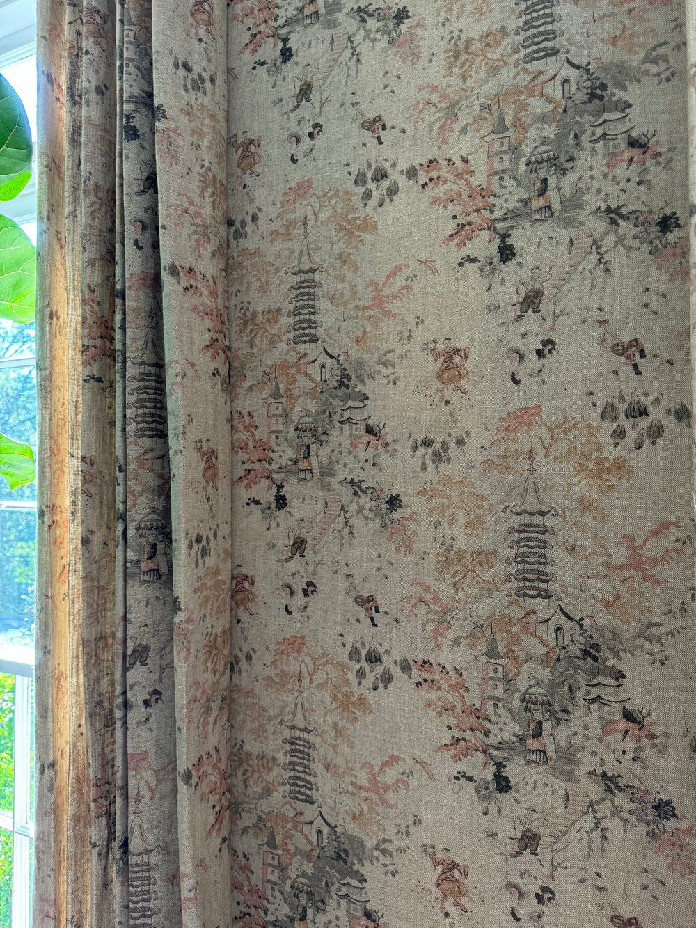 Textured fabric with intricate patterns and colors, possibly used for curtains or upholstery.