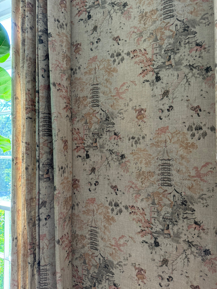 Textured fabric with intricate patterns and colors, possibly used for curtains or upholstery.