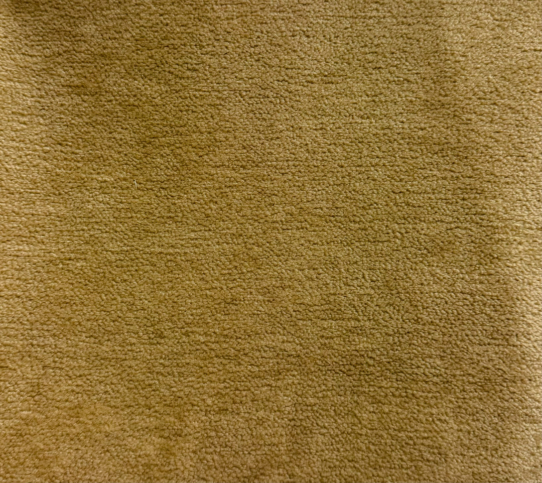 Close-up of a textured brown fabric surface