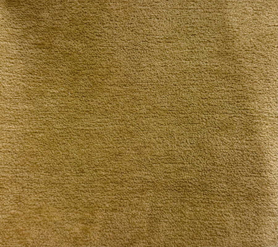 Close-up of a textured brown fabric surface