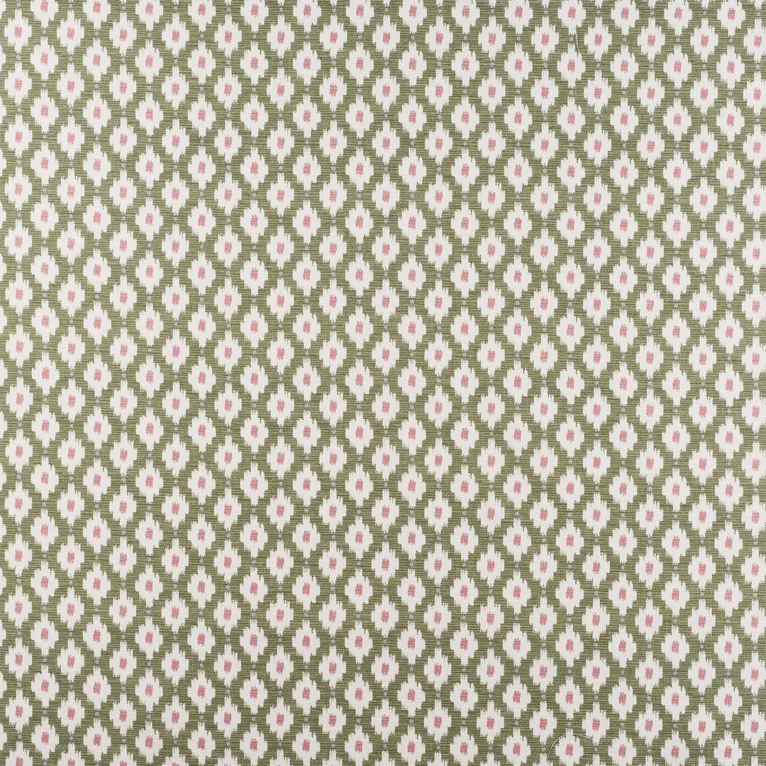 A close-up of a repeating fabric or wallpaper pattern featuring small pink flowers and green leaves arranged in a diamond ikat design on a muted sage green background.