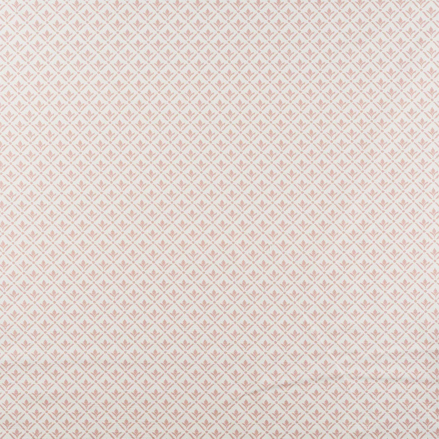 A close-up of a repeating fabric or wallpaper pattern in pale blush pink and off-white, showing a small diamond-and-floral motif across the full frame.