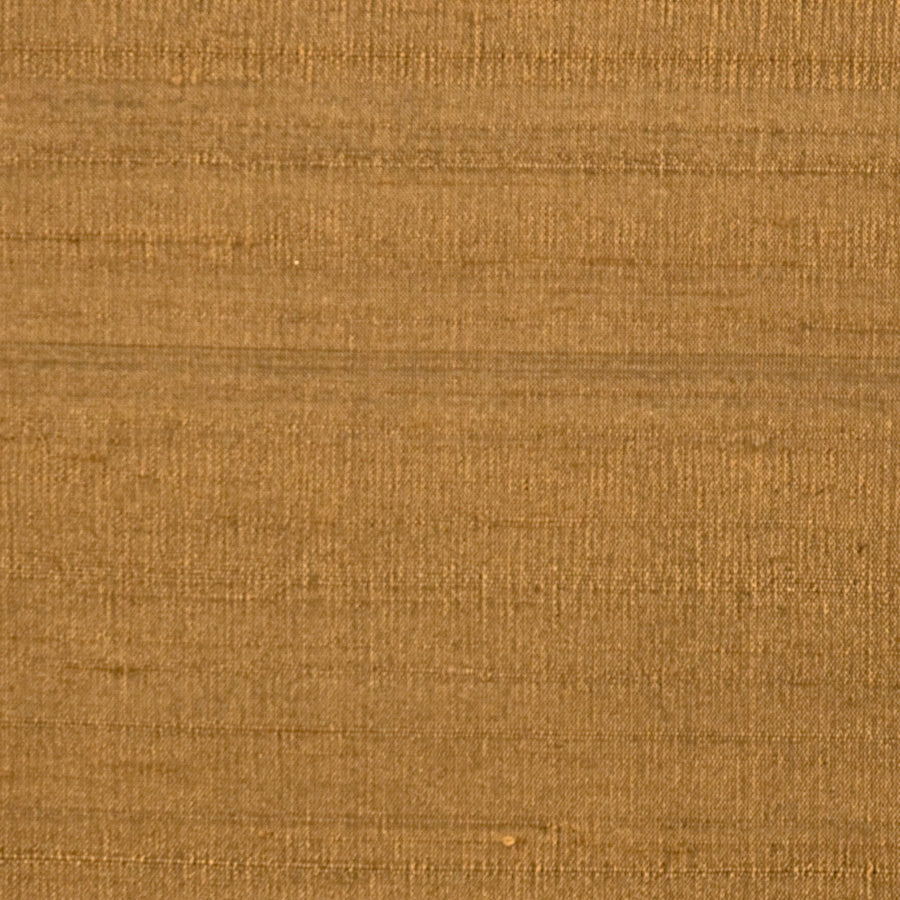 A close-up of a woven fabric texture in a warm tan or camel brown color, filling the entire frame.