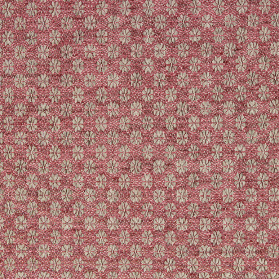 Patterned fabric with small floral design on a pink background