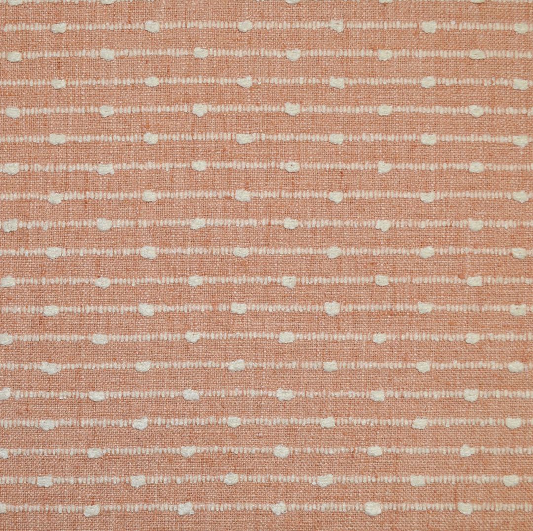 Textured fabric pattern with small white lines on a pink background