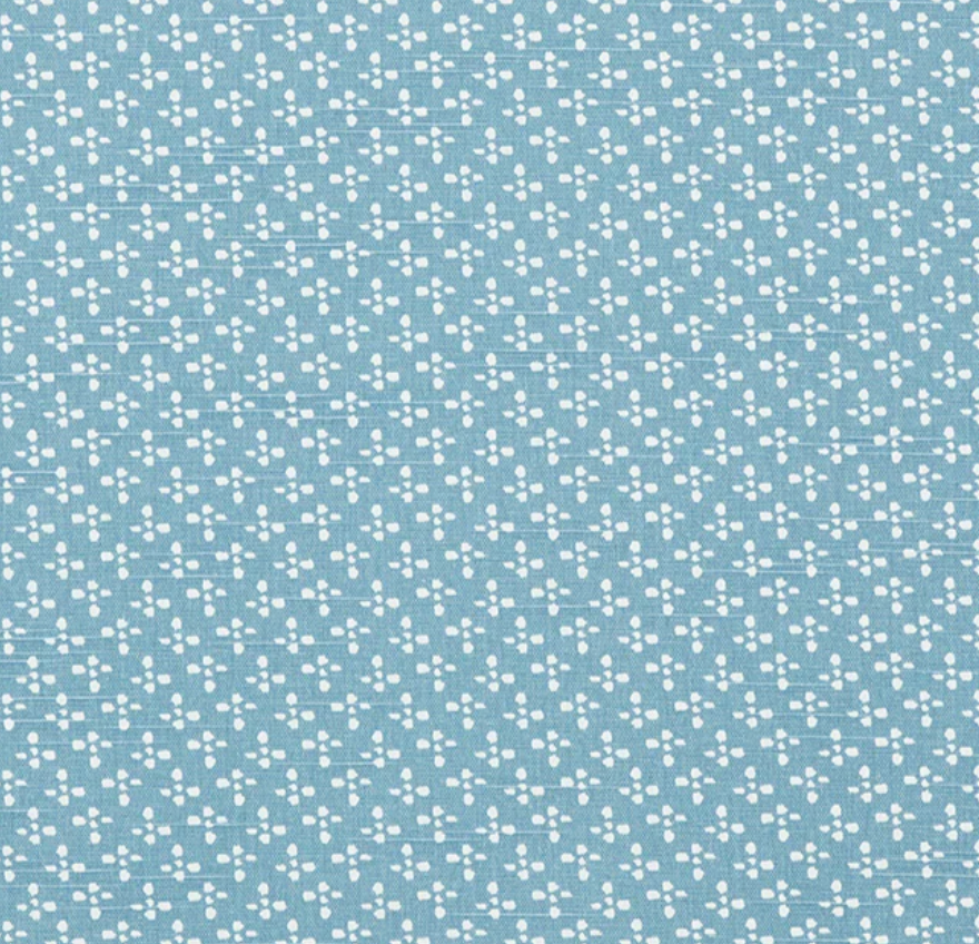 Blue fabric with small white floral pattern