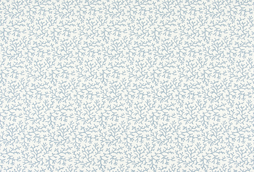 Floral and coastal blue patterned fabric on a white background