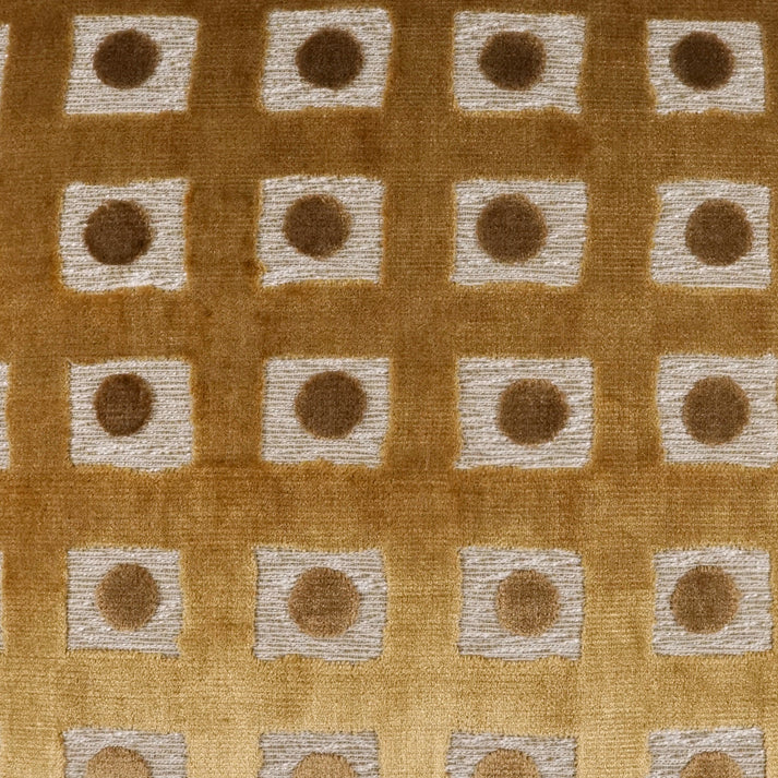 Patterned fabric with brown and beige squares and circles on a brown background