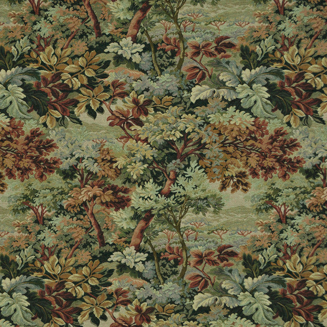 Close-up of a detailed tapestry fabric with a nature-themed design featuring trees and foliage.